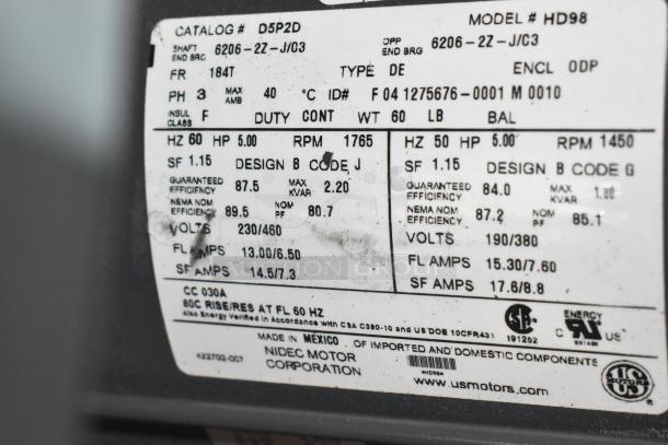 Nema HD98 motor label close-up, showing specifications: 260/460 volts, 3 phase, design B, 5 HP, Nidec Motor Corporation.