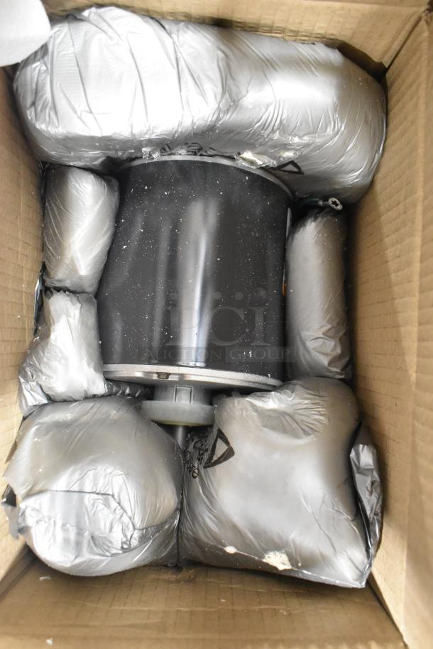 US Motors K55HXNRB-1127 condenser fan motor in box, 460V, 3-phase, sealed in protective packaging.