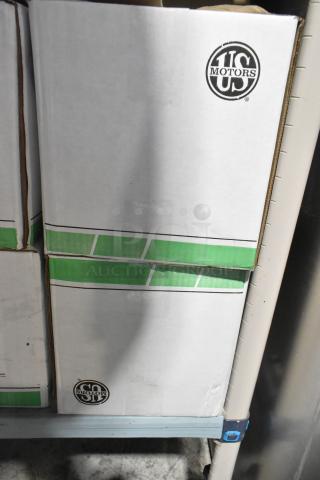 2 US Motors 1128 fan condenser motors in boxes, 460 volts, 3 phase. Boxes feature US Motors logo.
