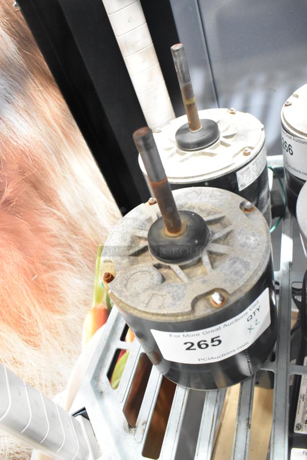 2 YSLB-300-6-B003 Motors, 380/460V, 1 Phase, visible rust, labeled "265 QTY x 2" from PCIAuctions.com.