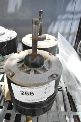Two interlink YSLB-300-6-B003 motors, 380/460V, 1 phase, with visible rust on shafts. Auction label indicates quantity of two.
