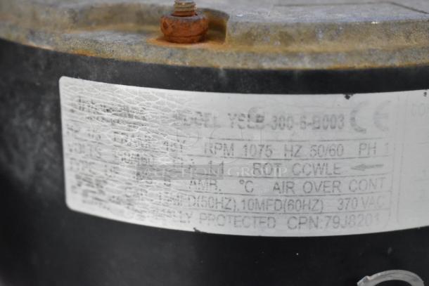 Interlink YSLB-300-6-B003 motor label, 380/460V, 1 phase, RPM 1075, air over, CE mark, lightly worn condition.