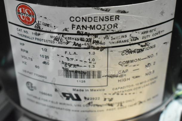 US Motors condenser fan motor label showing model K55HXNRB-1127, 460 volts, 1/2 HP, 1075 RPM. Made in Mexico.