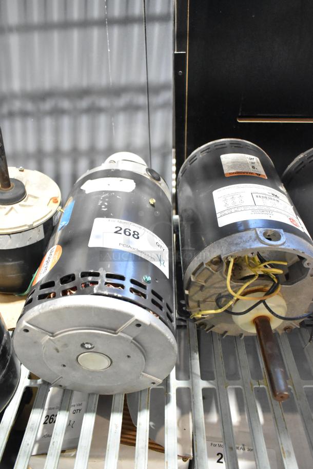 Two US Motors J63WZHRF-0309 condenser motors, 480V, 3-phase, with visible wiring and metal casing. Labels detail specifications.