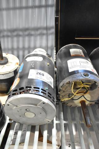 Two US Motors J63WZHRF-0309 condenser motors, 480V, 3-phase, with visible wiring and metal casing. Labels detail specifications.
