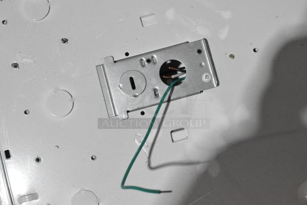 Pallet lot containing multiple fluorescent lights, wiring visible, metallic fixture, appears in good condition.