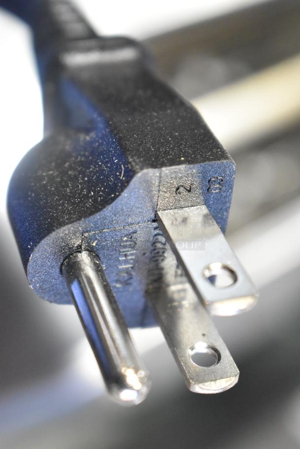 Power plug of the Cuisinart WST480 4 Slice Stainless Steel Toaster, brand new condition, showing minor scratches.