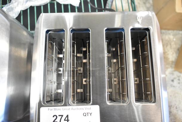 Silver Cuisinart WST480 4-slice toaster, stainless steel finish, brand new with minor scratches, auction tag visible.