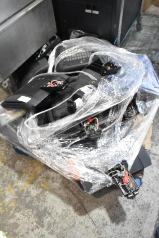 Bundle of eight various items including current light fixtures, wrapped in plastic. Items show wiring and components.