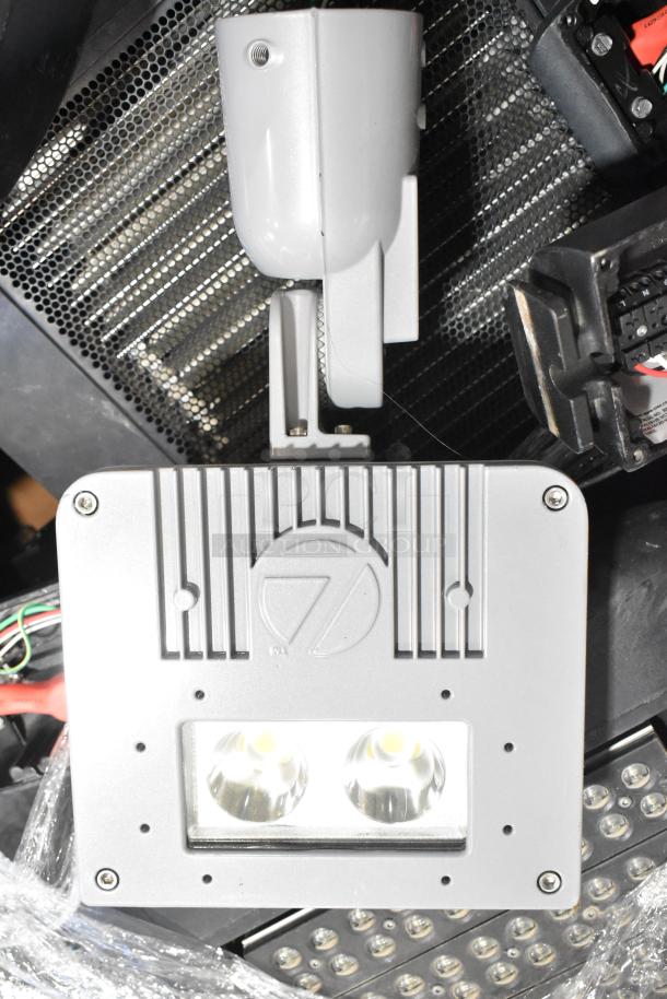 Set of 8 light fixtures, contemporary design, dual LED component. Appears in good condition. Ideal for modern settings.