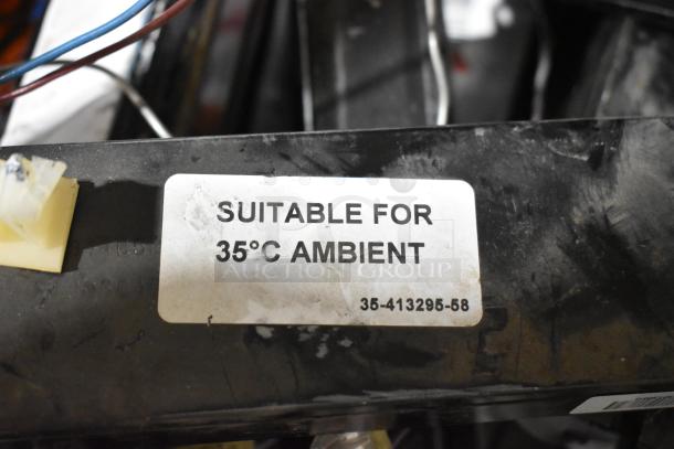 Lot of various items including ballasts with label "Suitable for 35°C Ambient" and part number 35-413295-58.