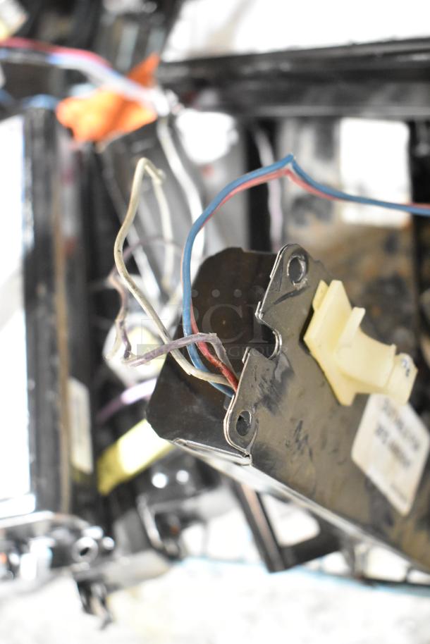 Lot of various electrical items with numerous ballasts. Visible wires and components. Labels partially visible. Used condition.