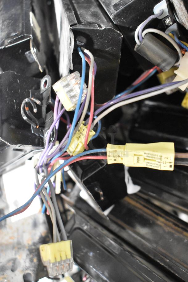 Lot of electrical components including ballasts, multi-colored wires, and connectors. Used condition.