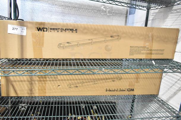 2 new WD West Durable Lighting VT40-WHT-4 LED vapor tight lights in original packaging, slight box damage visible.