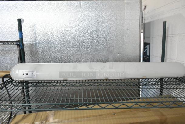 2 WD West Durable LED Vapor Tight Light in new condition on a metal shelf. Label reads "278, qty 2, PCI Auctions."