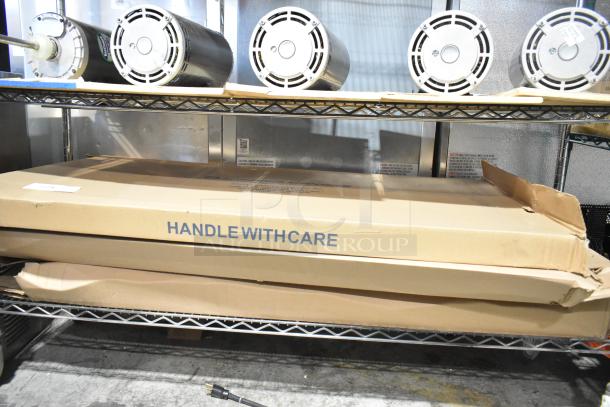 3 new Lithonia Lighting 2BLT4 LED recessed troffers in shipping boxes, marked "HANDLE WITH CARE", 120-277V.