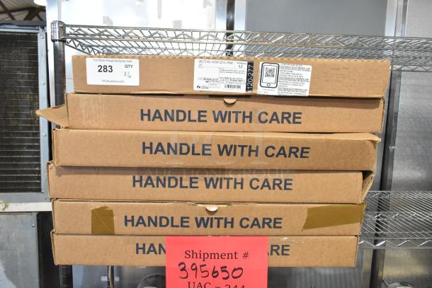 Six new Lithonia 2BLT4 40L ADSM GZ10 LP840 LED Troffers in boxes, "Handle With Care" labels visible. Quantity x6.