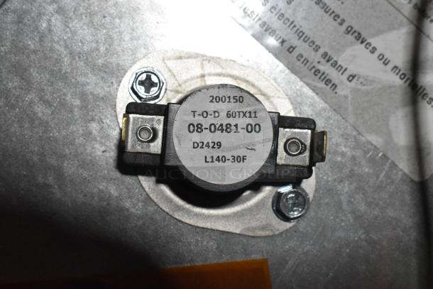 Metal box with visible part, marked "200150 T-O-D 60TX11 08-0481-00 D2429 L140-30F," featuring screws and metal casing.