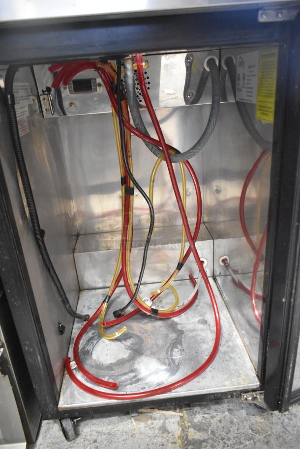 Yukon YDD-1 stainless steel kegerator interior showing colorful hoses, wires, and metal surfaces. 115 Volts, 1 Phase.