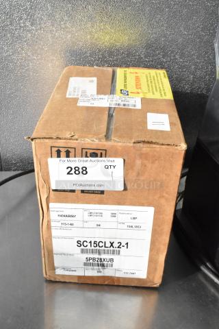 Secop SC15CLX.2-1 compressor in box, 3000 BTU, 115V, 1 phase, scratch and dent condition. Labels with model info visible.