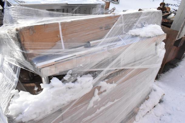 Three brand new scratch and dent items wrapped in plastic, including a 460EG2460DR3 shelf and stainless steel single bay sink.