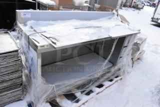 BRAND NEW SCRATCH AND DENT Regency 600EBTB2472R 24x72” 16 gauge stainless steel table with enclosed base, sliding doors, drawers, 6" backsplash.