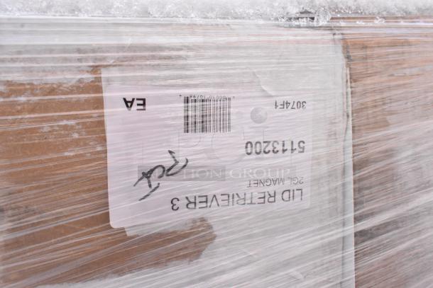 Plastic-wrapped pallet showing a label with barcode and numbers. Auction includes new scratch-and-dent items like Steelton shelving.