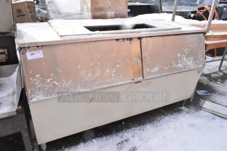 Follett Metal Commercial Ice Bin with visible surface wear, stainless steel construction, and built-in sliding doors. Tag labeled "301."