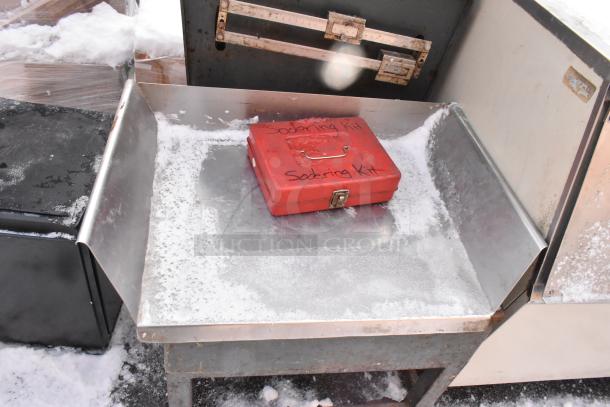 Hobart scale with stand on commercial casters, snowy condition, includes a red soldering kit labeled box.