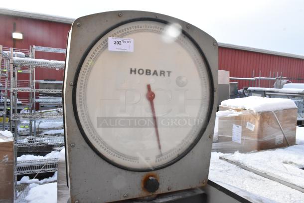Hobart scale with stand on commercial casters, large dial, visible model label, industrial condition, ideal for heavy-duty use.