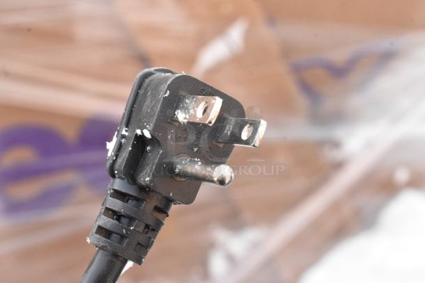Close-up image of a plug attached to a Hisense B9N6M Mini Cooler, showing a three-pronged, 115 Volt, 1 Phase connection.