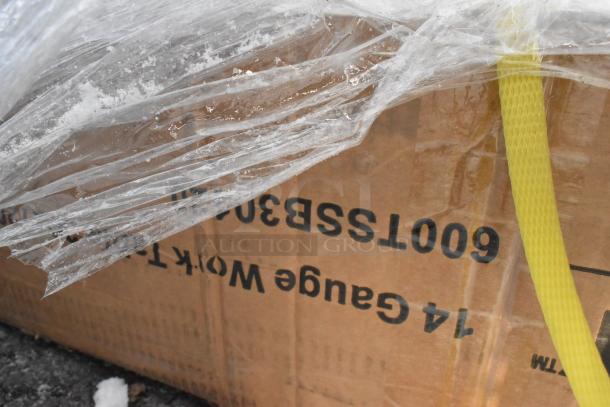 Cardboard box with protective plastic wrap, labeled "14 Gauge Work Table." Indicating new scratch and dent items.
