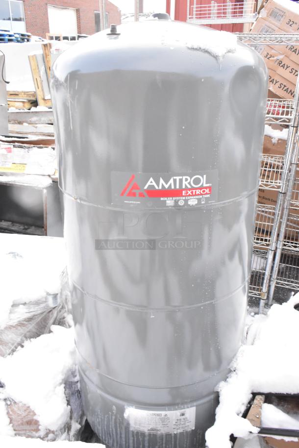 Amtrol Extrol SX130V expansion tank for boiler systems, gray, visible branding, outdoor setting with snow.