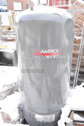 Amtrol Extrol SX130V expansion tank for boiler systems, gray, visible branding, outdoor setting with snow.