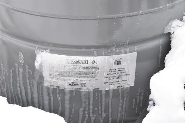 Amtrol Extrol SX130V boiler system expansion tank, gray, with visible label indicating max pressure 100 psi, model SX130V.