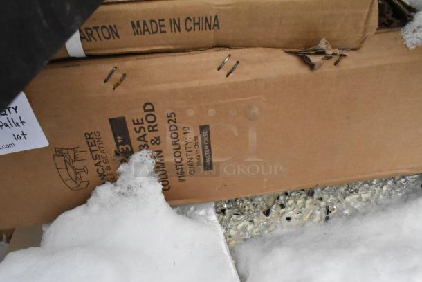 Pallet lot with cardboard boxes labeled "Made in China." Includes Lancaster table bases, shortening shuttles. Snow visible.