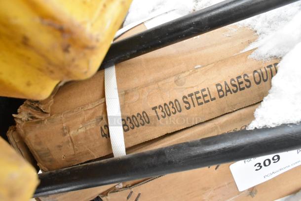 Pallet of various items including "T3030 Steel Bases" with visible scratch and dent condition. Auction label: 309.