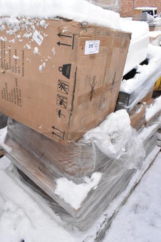 Pallet of 16 new items including drop mat shelves, tabletops, outdoor tables; minor imperfections; packed in snowy boxes.