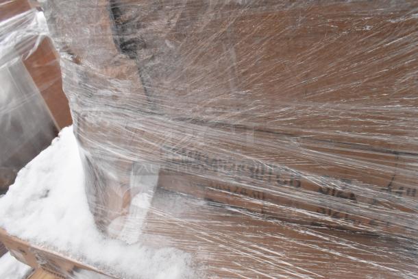 Pallet of various items wrapped in plastic, including drop mat shelves and tabletops. Scratch and dent condition.