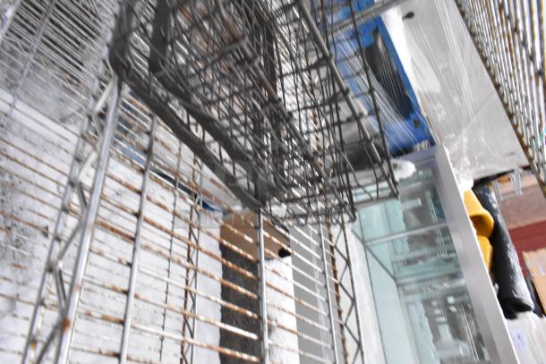 Pallet lot of 16 brand new, scratch and dent items including drop mat shelves and tabletops in various materials.