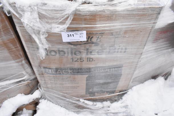 Pallet of items including a new Choice 125 lb. black mobile ice bin. Packaging shows "311 QTY x 2." In snowy setting.