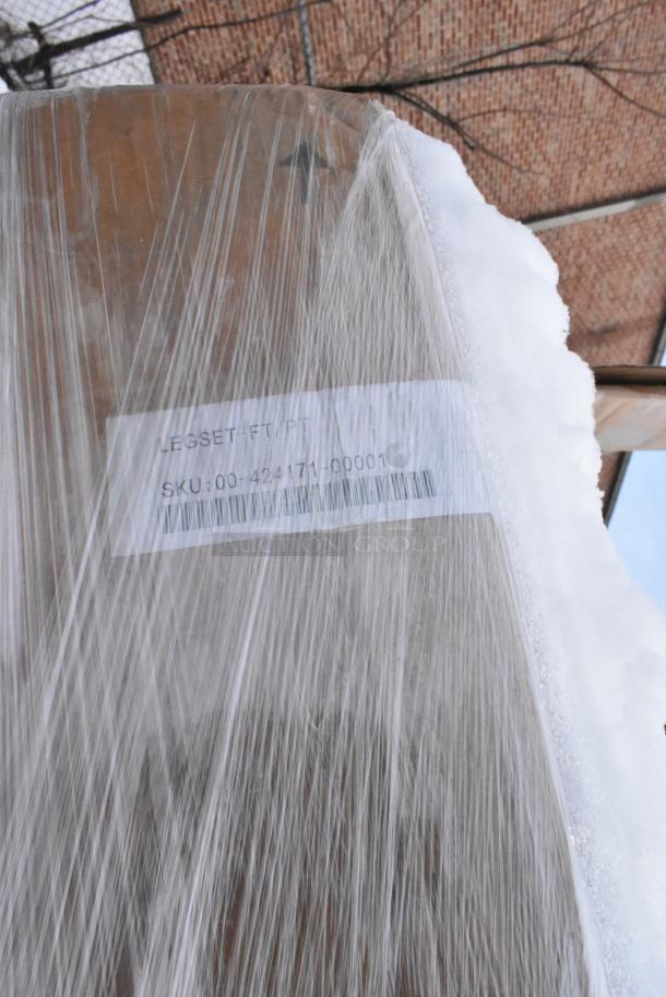 Pallet wrapped in plastic containing various new items. Visible label reads "LEGSET-FT/PT," SKU: 00-424171-00001.