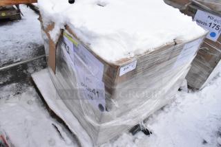 Pallet lot of brand new scratch and dent items including Metro glass racks and plates, wrapped in plastic, snow-covered. Tags visible.