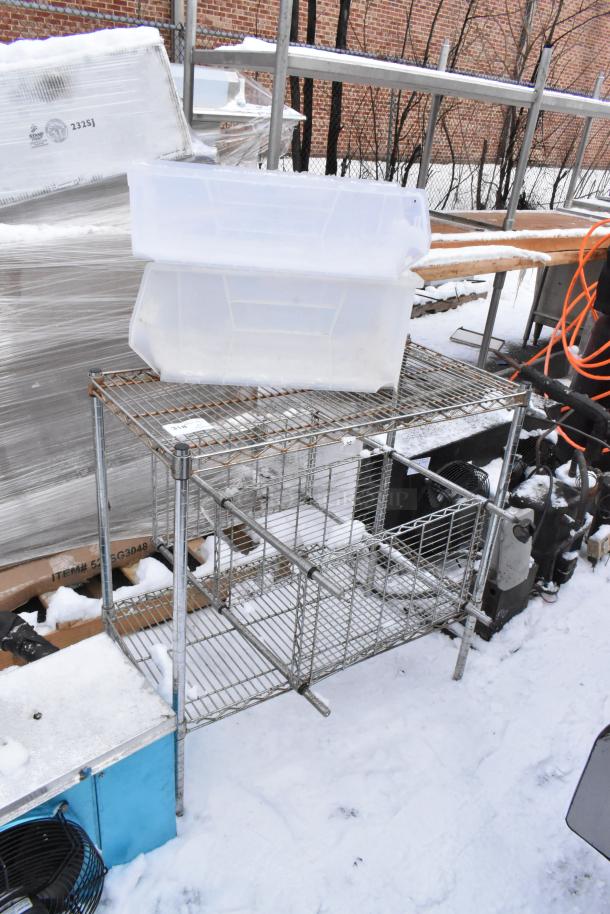 Two chrome finish wire shelving units, outdoor setting, requires dismantling. Includes plastic bins. Consider freight for shipping.