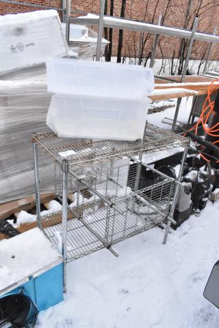 Two chrome finish wire shelving units, outdoor setting, requires dismantling. Includes plastic bins. Consider freight for shipping.