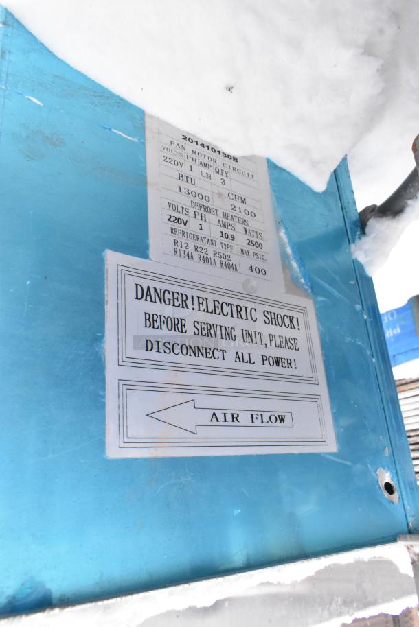 Metal commercial evaporator fan, 13,000 BTU, 220V, 1 phase, warning labels visible, blue casing.