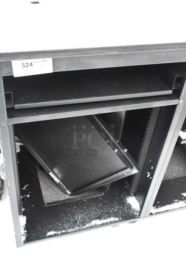 Two black metal counters with multiple shelves, scratched surface, and visible wear. Includes label "324 1/2/21 QTY X2."