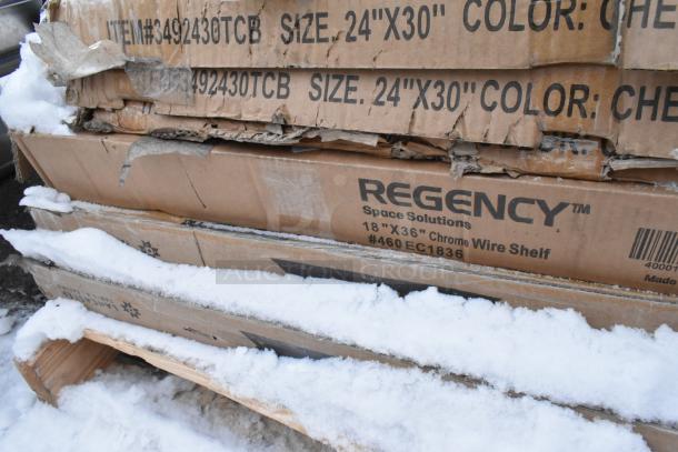 Cardboard boxes in snow, labeled Regency Space Solutions 18"x36" Chrome Wire Shelf, Ashland PolyTrap 4875 grease trap inside.