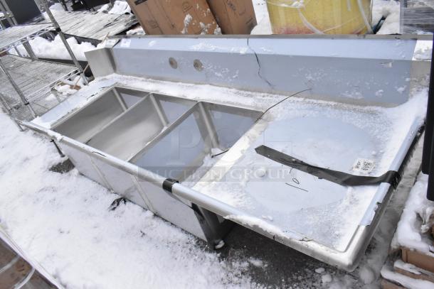 Brand new Regency 600DDTS384RT 16-gauge 7' dish table with 3-compartment sink, right drainboard, scratches visible.