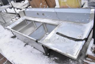 Brand new Regency 600DDTS384RT 16-gauge 7' dish table with 3-compartment sink, right drainboard, scratches visible.